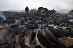 An Emergencies Ministry member walks at a site of a Malaysia Airlines Boeing 777 plane crash near the settlement of Grabovo in the Donetsk region in this July 17, 2014 file photo. Credit: REUTERS/Maxim Zmeyev/Files