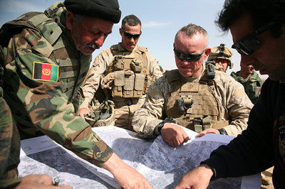 US Marine Brigadier General Larry Nicholson is briefed by Afghan Colonel Ghullam Dastagir on the western edge of Marjah, in central Helmand, moments before a Taleban rocket screamed overhead  (Credit: Jerome Starkey, www.flickr.com)