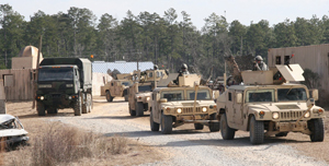 Soldiers of Alpha Troop, 1/278th Armored Combat Regiment, Tennessee National Guard, move into the mock city of Aljaffah located at Camp Shelby Joint Forces Training Center, Camp Shelby, Miss., while performing convoy operations training. The 278th is scheduled to leave for Iraq in early spring for their convoy security mission. (Courtesy: U.S. Army photo by Staff Sgt. Tekecia Simpson, 177th Armored Brigade, January 14th, 2010)
