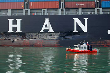 The Cosco Busan anchored in San Francisco Bay after striking the Bay Bridge on the foggy morning of Nov. 7, 2007 (Credit Photo: International Bird Rescue Research Center; www.ibrrc.org)