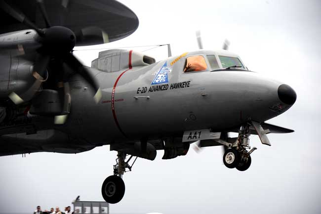 An E-2D Hawkeye assigned to Air Test and Evaluation Squadron 20 completes a "touch-and-go" exercise aboard the aircraft carrier USS Harry S. Truman. The "D" model is aboard Harry S. Truman for carrier suitability testing before delivery to the fleet. Harry S. Truman is supporting fleet replacement squadron carrier qualifications. (Credit: USN Visual Service, 2/3/11)