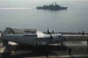 The Australian navy minesweeper HMAS Towoomba (FFH-156) is underway alongside the aircraft carrier USS Nimitz (CVN 68). (Credit: USS Nimitz 10/28/09)