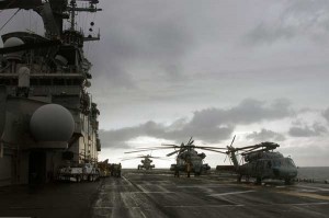 Amphibious assault ship USS Kearsarge (LHD 3) prepares to launch a UH-1N Huey and two CH-53E Sea Stallion helicopters assigned to Marine Medium Helicopter Squadron (HMM) 261. (Credit: USN Visual Service, 11/3/07)
