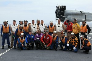 Marines, U.S. Navy sailors and sailors with the Japanese Maritime Defense Forces gather for a group photo after successfully landing an MV-22B Osprey from Marine Medium Tiltrotor Squadron 161 (VMM-161) onboard the JS Hyuga (DDG-181), during Dawn Blitz 2013 off the coast of Naval Base Coronado, June 14. Credit: 1st Marine Expeditionary Brigade, 