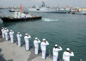 Sailors aboard the guided-missile destroyer USS Halsey (DDG 97) salute an Indian navy ship as Halsey prepares to pull into Chennai, India. Halsey is on a deployment to the Indian Ocean. Credit: Navy Media Content Services, 4/7/12 