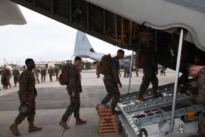 Marines board a KC-130J Hercules aircraft Nov. 10 at Marine Corps Air Station Futenma, Okinawa, Japan, moments before departing for a humanitarian assistance and disaster relief mission to the Philippines.  (Photo by Lance Cpl. David N. Hersey) 