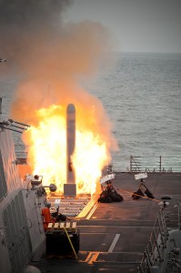A key element of cross domain synergy is F-22s and then F-35s cuing up the strike fleet whereby Aegis becomes a wing man for the airborne sensor and strike fleet. The photo is of a Tomahawk launch in the Pacific from the USS Sterett in 2010. Credit Photo: USN