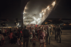 the first use of the C-17 is highlighted. Displaced Filipinos and other international personnel offload from a C-17 Globemaster III with the 535th Air Lift Squadron out of Hickam Field, Honolulu, HI, after leaving Tacloban Air Field, Nov. 15. Credit: 31st MEU 