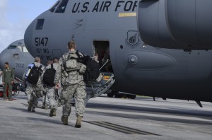 Airmen from the 36th Contingency Response Group board a C-17 Globemaster III Nov. 15, 2013, on the Andersen Air Force Base, Guam, flightline before departing to support Operation Damayan in Tacloban, Philippines. Operation Damayan is a U.S. humanitarian aid and disaster relief effort to support the Philippines in the wake of the devastating effects of Typhoon Haiyan. (U.S. Air Force photo by Senior Airman Marianique Santos/Released),