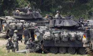 Photo Credit: U.S. Army soldiers and its M2A2 Bradley fighting vehicles take part in the U.S.-South Korea joint military exercise against possible attacks by North Korea, at a shooting range near the demilitarized zone separating the two Koreas in Paju, about 45 km (28 miles) north of Seoul, June 8, 2011. Credit: Reuters/Jo Yong-Hak