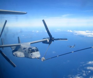 An MV-22B Osprey with Marine Medium Helicopter Squadron 262, refuels mid-air en route to the Singapore Air Show, Feb. 6, 2014. Three Ospreys from VMM-262 and two KC-130J Super Hercules planes of VMGR-152, part of the 1st Marine Air Wing, III Marine Expeditionary Force, based out of Okinawa, Japan, are participating in the Singapore Air Show 2014.III MEF, 2/6/14 