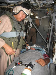 Chief Petty Officer Richard B. Guerrero, a Chief Hospital Corpsmen with Marine Medium Tiltrotor Squadron 263 (Reinforced), 22nd Marine Expeditionary Unit, cares for a patient aboard an MV-22B Osprey during an emergency medical evacuation June 25, 2009.  The Sailor sustained head and hip injuries and was experiencing chest pains after falling while aboard USS Bataan (LHD 5).  This is the first time the Osprey has been used to conduct an emergency evacuation from a U.S. Naval ship. (Official USMC photo)