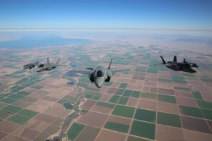Three F-35B Lightning II Joint Strike Fighters with Marine Fighter Attack Squadron 121, 3rd Marine Aircraft Wing, and two AV-8B Harriers with Marine Attack Squadron 211, 3rd MAW, fly in a “V” formation during  fixed-wing aerial refueling training over eastern California, Aug. 27. The F-35B joint strike fighters practiced refueling with Marine Aerial Refueler Transport Squadron 352.  (Photo by Lance Cpl. Michael Thorn) 