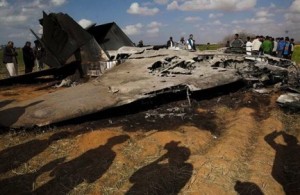 Libyans inspect the wreckage of an Air Force F-15 after it crashed in on March 22, 2011. Imagine the propaganda value if the pilot had been captured.(AP) 