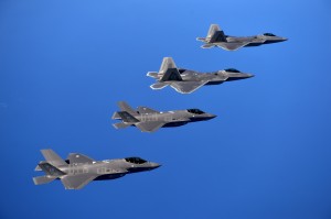 F-22 Raptors from the 94th Fighter Squadron, Joint Base Langley-Eustis, Virginia, and F-35A Lightning IIs from the 58th Fighter Squadron, Eglin Air Force Base, Florida, fly in formation after completing an integration training mission over the Eglin Training Range, Florida, Nov. 5, 2014. The purpose of the training was to improve integrated employment of fifth-generation assets and tactics. The F-35s and F-22s flew offensive counter air, defensive counter air and interdiction missions, maximizing effects by employing fifth-generation capabilities together. (U.S. Air Force photo/Master Sgt. Shane A. Cuomo) 