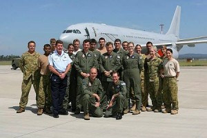(Kneeling left) Air Commodore Gary Martin AM, CSC, Commander Air Lift Group, (kneeling right) Wing Commander Geoff Fox, Commanding Officer No. 33 Squadron (33SQN) along with representatives from every section in 33SQN, all standing in front of one of the newly acquired KC-30As at RAAF Base Amberley. 
