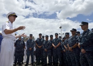 Chief of Naval Operations Adm. Jonathan Greenert talks with sailors assigned to the Los Angeles-class attack submarine USS Columbus (SSN-762). Greenert is aboard the boat during a visit to Joint Base Pearl Harbor-Hickam. (U.S. Navy photo by Chief Mass Communications Specialist Julianne F. Metzger/Released)