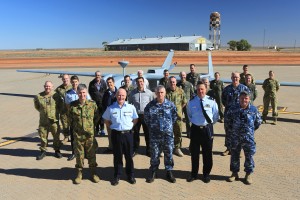 (Front row L-R) Air Commodore Adam Brown, Director General Aerospace Maritime, Training & Surveillance, Air Commodore Noel Schmidt from the Airworthiness Co-ordination and Policy Agency, Air Commander Australia, Air Vice-Marshal Gavin Turnbull, Air Vice-Marshal Chris Spence, Airworthiness Co-ordination and Policy Agency and Commander Surveillance and Response Group, Air Commodore Chris Westwood stand along with members from No 5 Flight and the Airworthiness board in front of the Heron Remotely Piloted Aircraft at RAAF Base Woomera. Credit: Australian Ministry of Defence 
