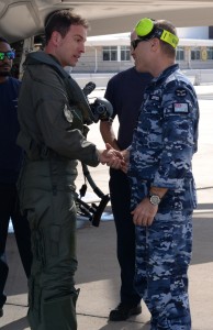 An Italian F-35 Lightning II pilot shakes the hand of Squadron Leader Nathan Draper, Australian Participant Maintenance Liaison Officer, November 5, 2015, at Luke Air Force Base after flying the first Italian F-35 training mission. (U.S. Air Force photo by Airman 1st Class Ridge Shan) 