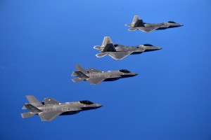 F-22 Raptors from the 94th Fighter Squadron, Joint Base Langley-Eustis, Va., and F-35A Lightning IIs from the 58th Fighter Squadron, Eglin Air Force Base, Fla., fly in formation after completing an integration training mission over the Eglin Training Range, Florida, Nov. 5, 2014. The purpose of the training was to improve integrated employment of fifth-generation assets and tactics. The F-35s and F-22s flew offensive counter air, defensive counter air and interdiction missions, maximizing effects by employing fifth-generation capabilities together. (U.S. Air Force photo/Master Sgt. Shane A. Cuomo) 