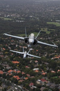 An A21 F/A-18 Hornet (front), piloted by Wing Commander Glen Beck from No77 Squadron, and an A44 F/A-18F Super Hornet 'Rhino', piloted by Flight Lieutenant Andrew Habersberger from No1 Squadron fly over Melbourne, Victoria during the Australian International Airshow 2011. The 2011 Australian International Airshow and Aerospace & Defence Exposition, held at Avalon in Victoria from 1-6 March, coincides with the Royal Australian Air Forces 90th birthday. Air Forces Airshow activities celebrate this milestone by remembering our past and looking to our future with the theme tradition, innovation, evolution. 