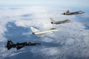 A U.S. Air Force T-38 Talon, British Royal Air Force Typhoon, French air force Rafale and U.S. Air Force F-22 Raptor fly in formation as part of a Trilateral Exercise held at Langley Air Force Base, Va., Dec. 7, 2015. The 1st Fighter Wing hosted the exercise which focuses on operations in a highly-contested operational environment. (U.S. Air Force photo by Senior Airman Kayla Newman) 