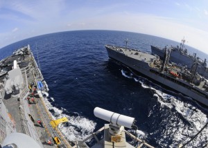USS Kearsarge, left, and USS Ponce, right, are alongside USNS Kanawha during a replenishment at sea. Kearsarge is the command ship of Kearsarge Amphibious Ready Group, supporting maritime security operations and theater security cooperation efforts in the U.S. 6th Fleet area of responsibility. (U.S. Navy photo by Petty Officer 3rd Class Scott Pittman/Released) 