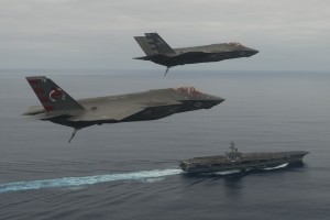 CF-03 Flt 193 (Mr. Elliott Clemence) and CF-05 Flt 100 (LCDR Theodore Dyckman) perform a flyover of the USS Nimitz during CVN DT-1. 