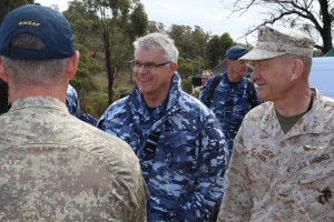 Air Commander Australia, Air Vice Marshal Gavin Turnbull (centre), AM, chats with other exercise participants including Lieutenant General Jon Davis (right), Deputy Commandant for Aviation, United States Marine Corps, at Exercise Jericho Dawn 2016 firepower demonstration at Puckapunyal training area, Victoria, on 18 March 2016. *** Local Caption *** The Royal Australian Air Force (RAAF) and Australian Army, with support from Northrop Grumman, have successfully conducted a firepower demonstration and a combat team quick attack demonstration at Puckapunyal Military Area as part of Exercise Jericho Dawn to display the powerful effects of integrated air and land operations. The live fire exercise allowed RAAF and Army operators, together with Defence and Industry representatives, to observe the combined air and land capabilities in two scenarios. The operators demonstrated the current capabilities, before trialling new ways to improve air-land integration, including the way that aircraft and vehicles connect and translate information through different communication networks. 