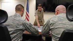 U.S. Marine Corps 1st Lt. Samuel Winsted, F-35B Lightning II intelligence officer, provides a mock intelligence briefing to two instructors during the F-35 Intelligence Formal Training Unit course, June 17, 2015, on Eglin Air Force Base, Fla. Winsted will serve in a critical role assisting the Marine Corps’ F-35 program at Marine Corps Air Station Yuma, Ariz., as it becomes the first operational F-35B base. The Marine Corps will declare IOC with the F-35B, short take-off and vertical landing variant, this summer. (U.S. Air Force photo/Staff Sgt. Marleah Robertson) 