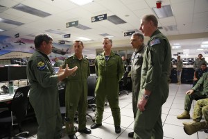 Combined Forces Air Component Commander, Air Commodore Chris Westwood briefs the Directors of the Combined Air Operations Centre (CAOC), (from left) Deputy Commander, Colonel David Lowthian, Captain John Alexander (Royal Canadian Air Force), Captain Charles Degilio (United States Navy - Reserve Component) and Group Captain Stuart Bellingham (RAAF). The briefing was conducted at the Combined Air Operations Centre during Exercise Rim of the Pacific (RIMPAC) 2014 at Joint Base Pearl Harbor - Hickham. *** Local Caption *** Air Commodore Chris Westwood is the Combined Forces Air Component Commander, the first time an Australian has been given this role. There is also a team of about 50 RAAF members in the AOC orchestrating the air campaign. Three AP-3C Orions are directly involved in the maritime patrols during the anti-submarine warfare phase. A number of 41 Wing Air Combat Officers are stationed with the Hawaiian Regional Operations Centre conducting air battle management operations for the exercise. Approx 200 aircraft are involved including about 90 fast jets, a large number of maritime patrol aircraft and a large number of helicopters as well as command and control aeroplanes  refuellers for example. About 4000 people contribute to the air campaign and about 200 people in the AOC. 22 nations are participating in RIMPAC 2014 including Australia, Canada, France, India, Indonesia, Japan, Malaysia, New Zealand, Republic of Korea, Singapore, the Philippines, Tonga, UK and the USA. China and Brunei will also take part in RIMPAC this year, for the first time. 2014 is the largest iteration of Exercise RIMPAC ever conducted with around 25,000 personnel, 49 surface ships, six submarines and more than 200 aircraft from across the Pacific Rim. 