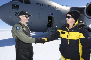 Commander Air Mobility Group, Air Commodore Richard Lennon, CSC is greeted by the Director of the Australian Antarctic Division, Dr Nick Gales, after arriving at Wilkins Aerodrome. *** Local Caption *** The Australian Antarctic Division and Royal Australian Air Force have successfully flown a joint operational mission to East Antarctica, with a C-17A Globemaster III delivering heavy lift cargo to Wilkins Aerodrome in support of the Australian Antarctic programme. The C-17A flew the 3450km, landing at Wilkins Aerodrome near Casey station on 21 November 2015 where it unloaded cargo, including a brand new Hägglunds, a dual cab vehicle that operates over snow and infrastructure building materials. The flight is one in a series of proof of concept flights being trialled by the Royal Australian Air Force and Australian Antarctic Division, with the remaining flights scheduled to take place between November 2015 and February 2016. 