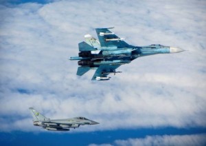 Ministry of Defence handout photo of a Russian SU-27 Flanker (top) with a RAF Typhoon fighter during an intercept by RAF Typhoon that were scrambled to intercept "multiple Russian aircraft" as part of the Nato mission to police the airspace over the Baltics, the Ministry of Defence has said during an earlier air patrol. Typhoons have just left for their next round of doing such a patrol. Maybe the Russians would be afraid of taking on a real jet rather than trying to intimidate a surveillance aircraft with NO ejection seats. 
