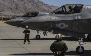 Marine F-35B aircrew members, assigned to the 3rd Marine Aircraft Wing, Marine Corps Air Station Yuma, Az., perform pre-flight checks and participate in Red Flag 16-3 at Nellis Air Force Base, Nev., July 12, 2016. Since its establishment in 1975, Red Flag has played host to military units from more than 30 countries to participate in high-end flight integration. (U.S. Air Force photo by Airman 1st Class Kevin Tanenbaum) 
