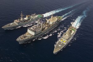 Sept 01 2002. Top front 3/4 view. Ship Formation in the Gulf of Oman. From right to left HMCS Algonquin,HMCS Protecteur and HMCS St-Johns. The formation took place during a (RAS) Replenishment at sea, followed by manouvers. HMCS ST-JOHNS is operating in and around the Gulf of Oman as part of Operation APOLLO, Canada's military contribution to the international campaign against terrorism. Photo by: MCpl Michel Durand, Formation Imaging Services, Halifax 