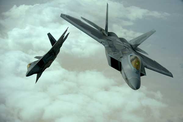 U.S. Air Force F-22 Raptors fly in formation during a training mission, Dec. 6, 2009. (Credit: USAF)