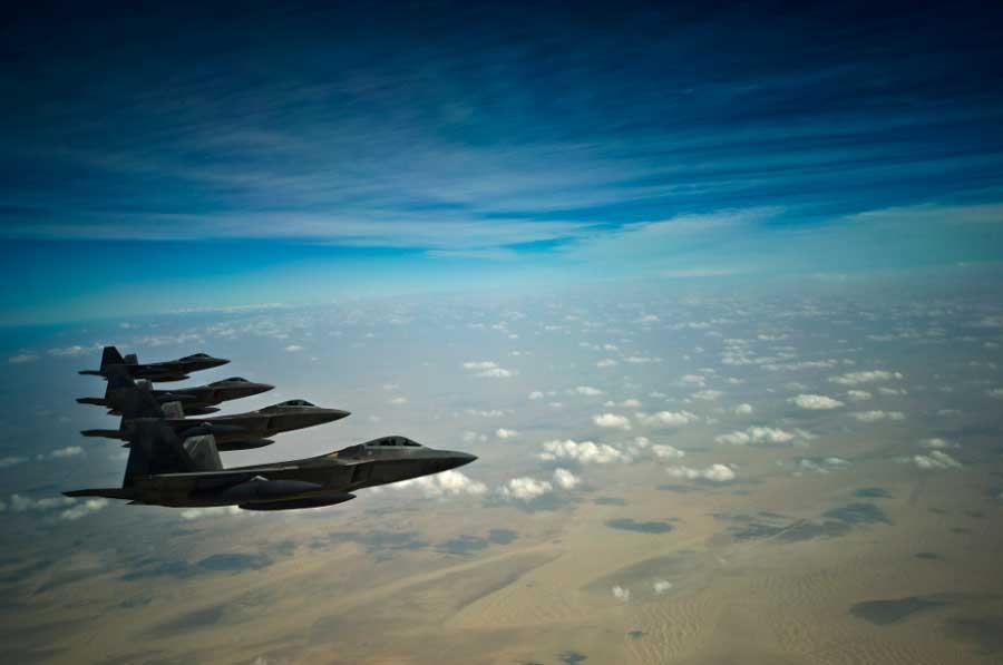 F-22 Raptors fly in formation during a training mission Dec. 9